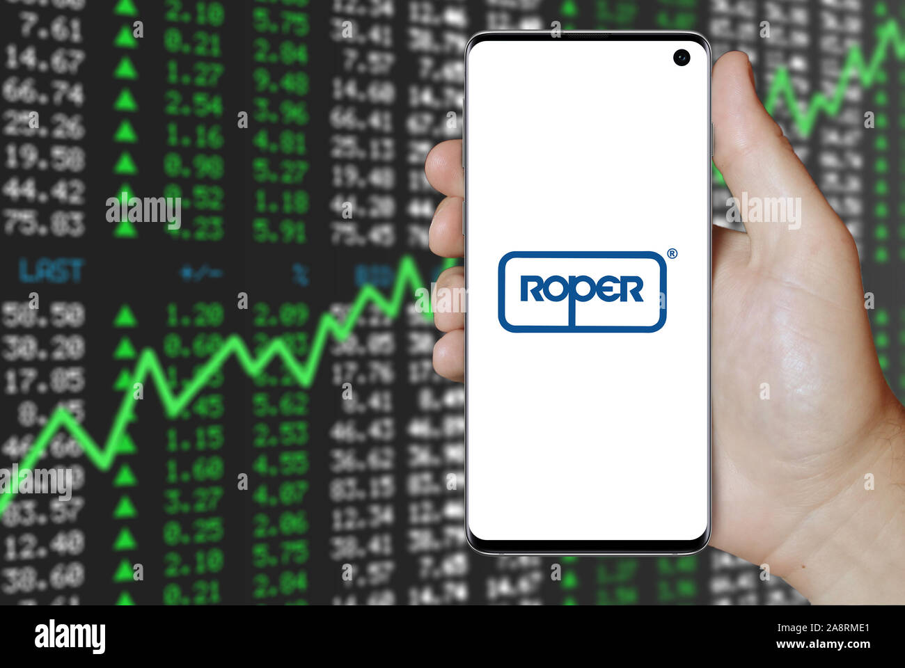 Logo of public company Roper Technologies displayed on a smartphone. Positive stock market background. Credit: PIXDUCE Stock Photo