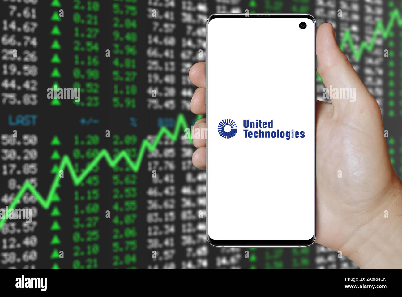 Logo of public company United Technologies displayed on a smartphone. Positive stock market background. Credit: PIXDUCE Stock Photo