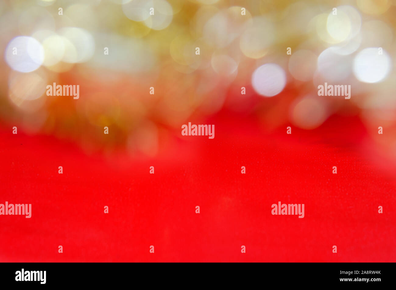 Abstract blurred yellow bokeh on  red background Stock Photo