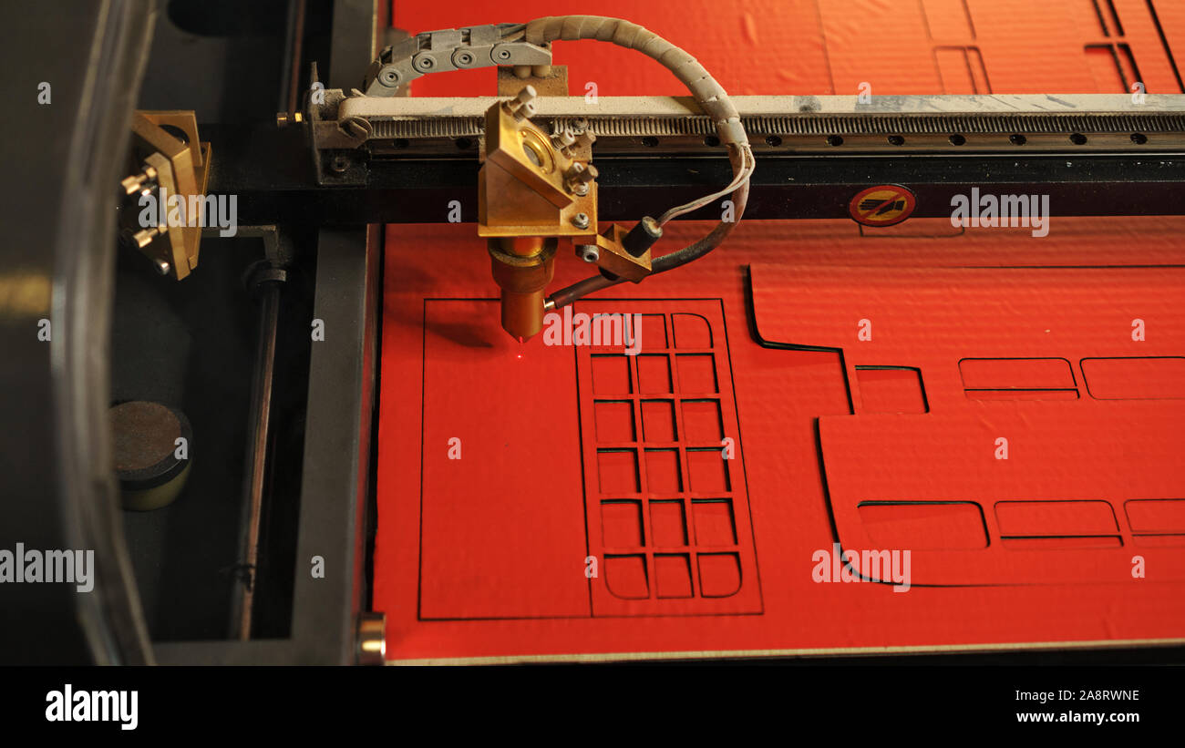 Laser cutting beam high precision on a paperboard. Modern machine
