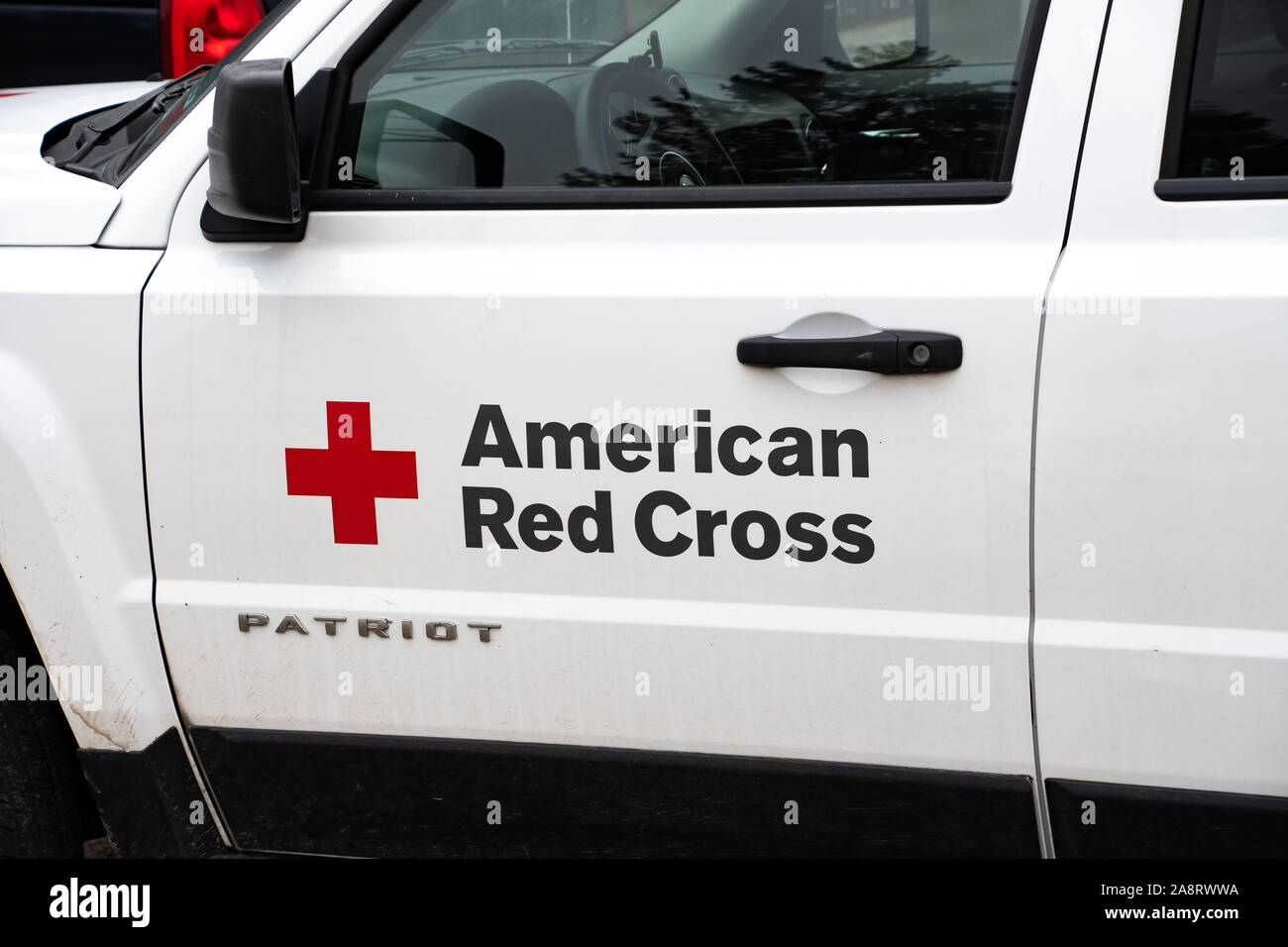 An American Red Cross Jeep Patriot parked in Speculator, NY USA to render assistance to victims of a Halloween night storm resulting in major flooding Stock Photo