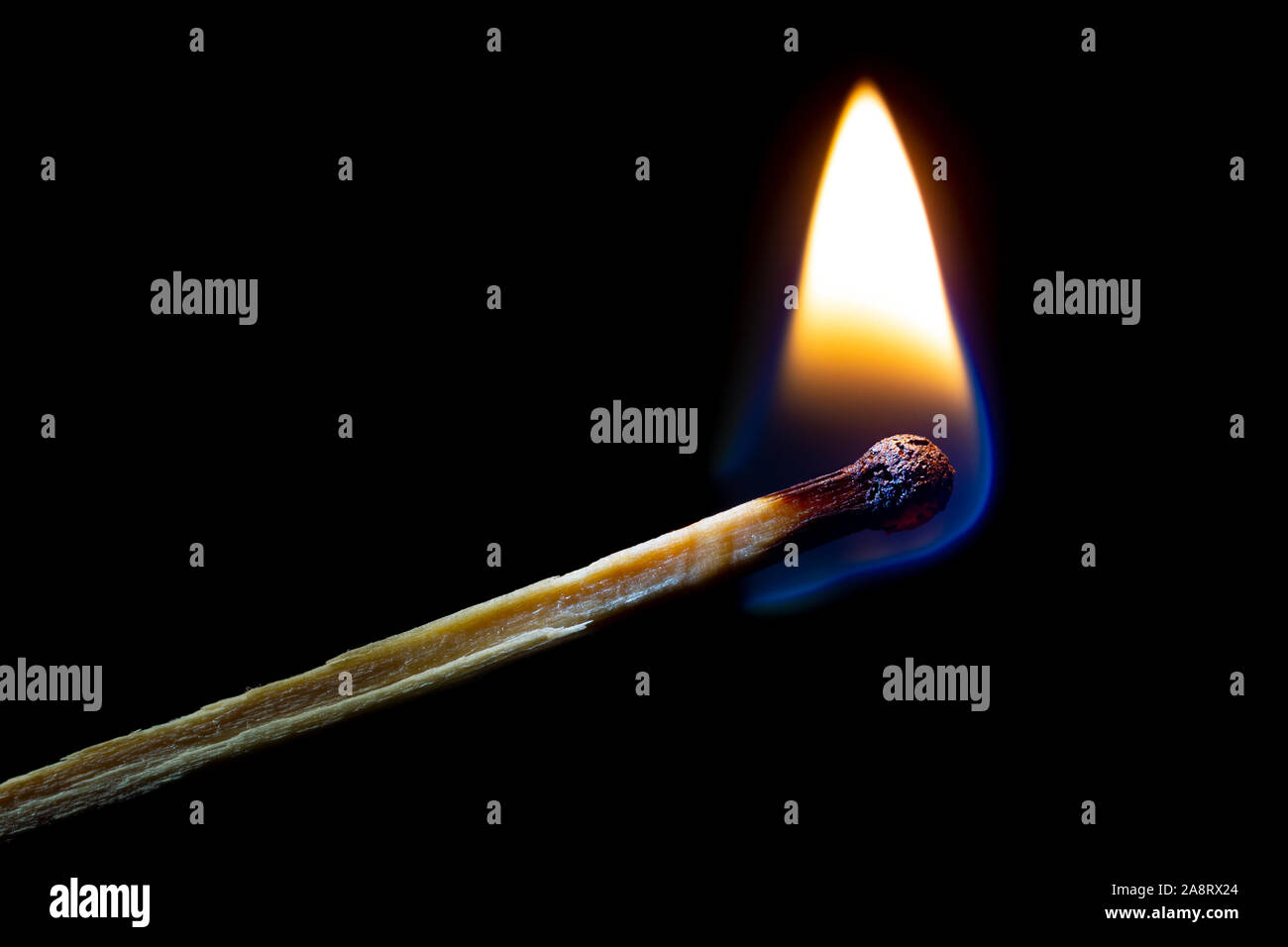 Burning match on a dark background. Closeup Stock Photo - Alamy