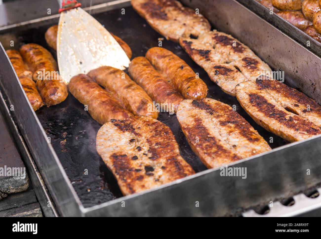 Barbecue chorizo sausages, Argentina staple food, at a street food