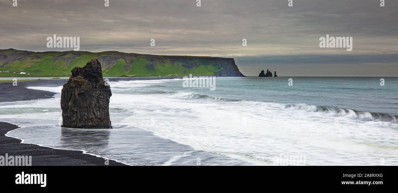 ICELAND LANDSCAPE: Reynisfjara Beach view point Dyrholaey. Famous Iceland black sand beach on South Iceland. Icelandic nature landscape tourist attraction destination. Stock Photo