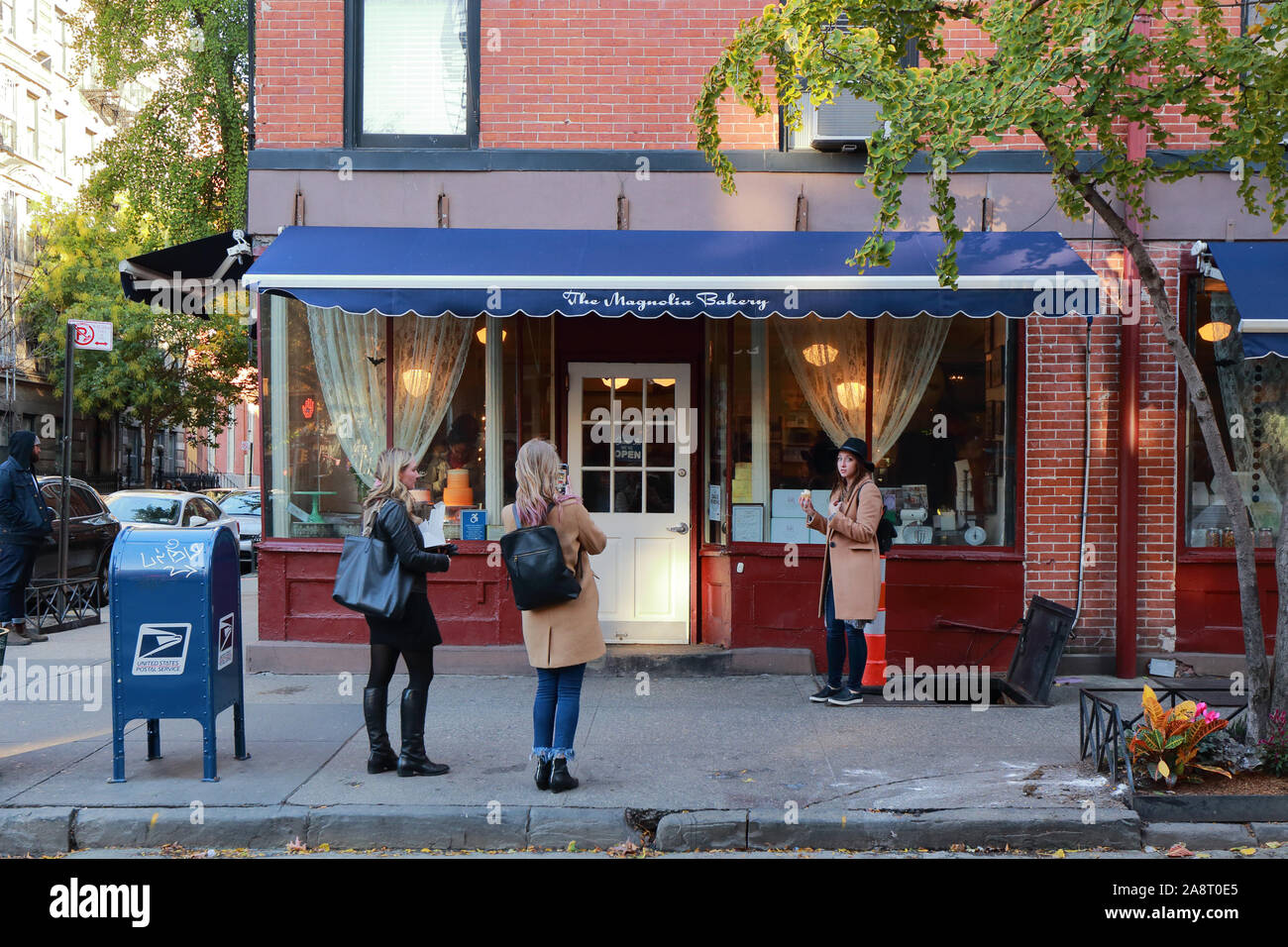 Magnolia Bakery, 401 Bleecker Street, New York, NY.  exterior storefront of a cupcake bakery, bake shop in the West Village neighborhood of Manhattan. Stock Photo