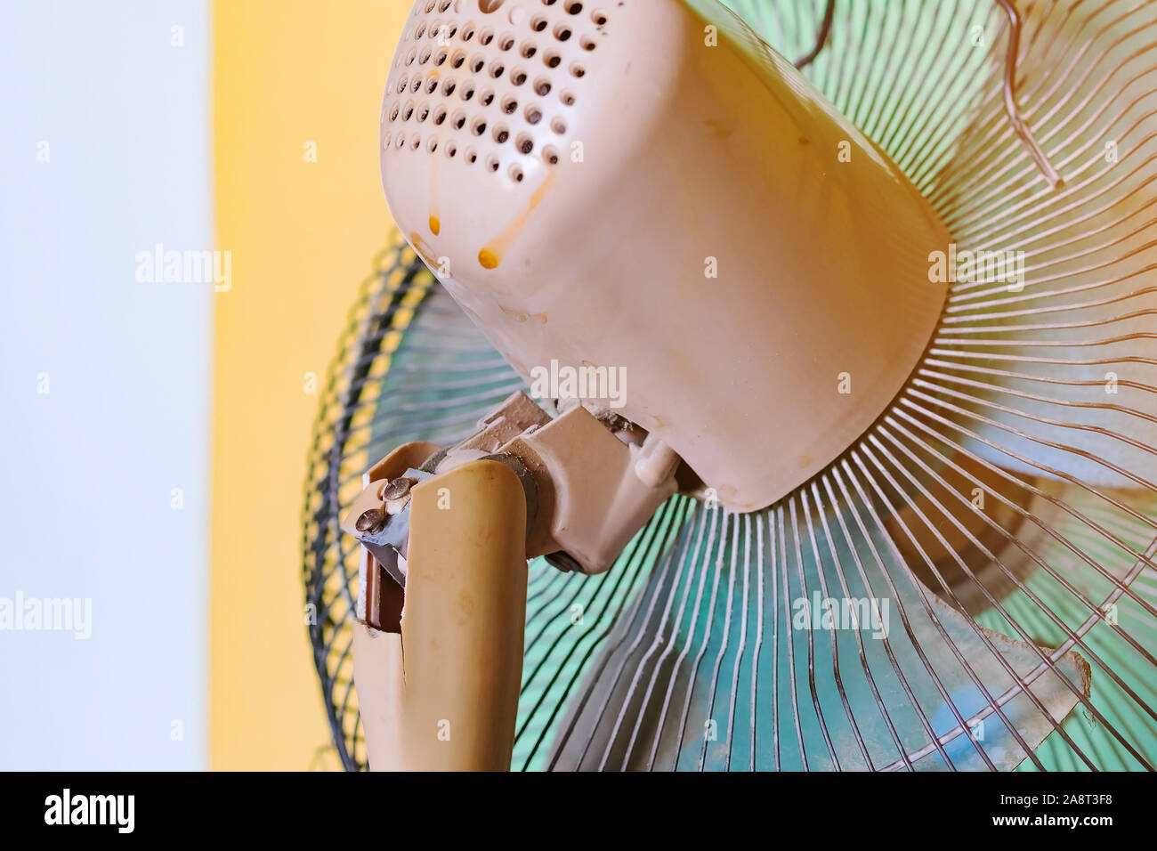 Close up to the old plastic joints of the electronic fan damaged and ...