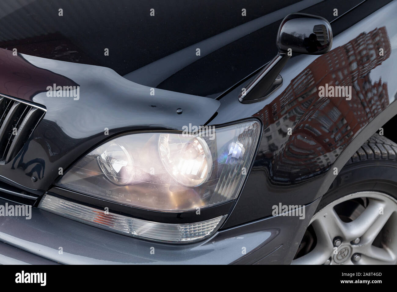 Novosibirsk, Russia - 11.05.2019: Black Toyota Harrier or Lexus RX300 1997 year headlight and mirror view with gray interior in excellent condition in Stock Photo