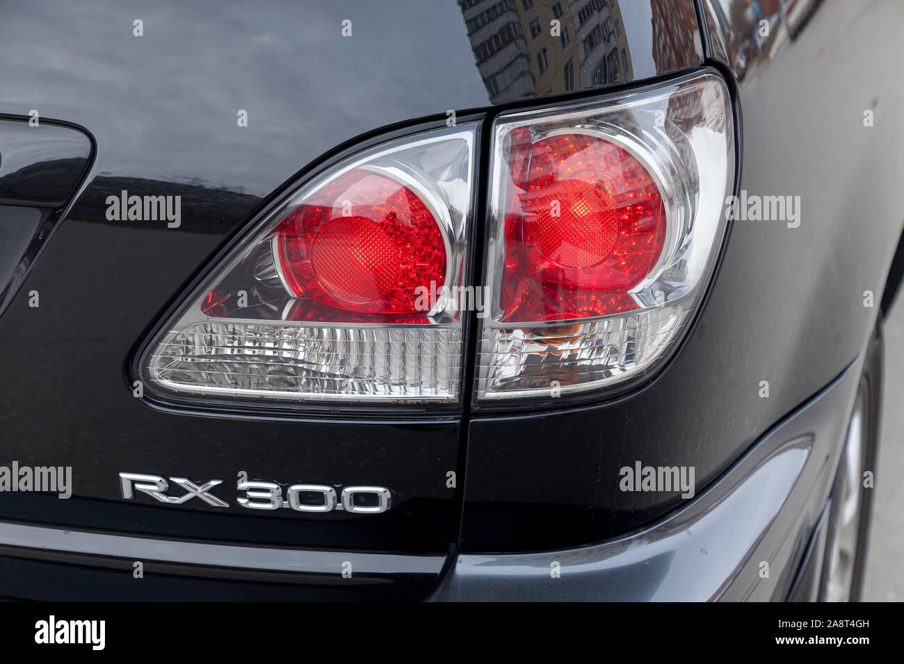 Novosibirsk, Russia - 11.05.2019: Black Toyota Harrier or Lexus RX300 1997 year rear taillamp view with gray interior in excellent condition in a park Stock Photo