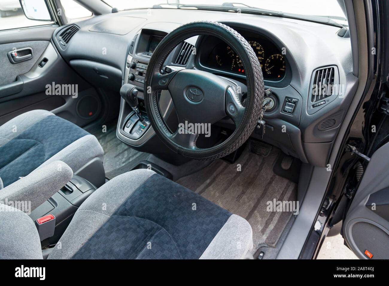 Novosibirsk, Russia - 11.05.2019: View to the gray interior of Toyota Harrier or Lexus RX300 with dashboard, clock, media system, front seats and shif Stock Photo
