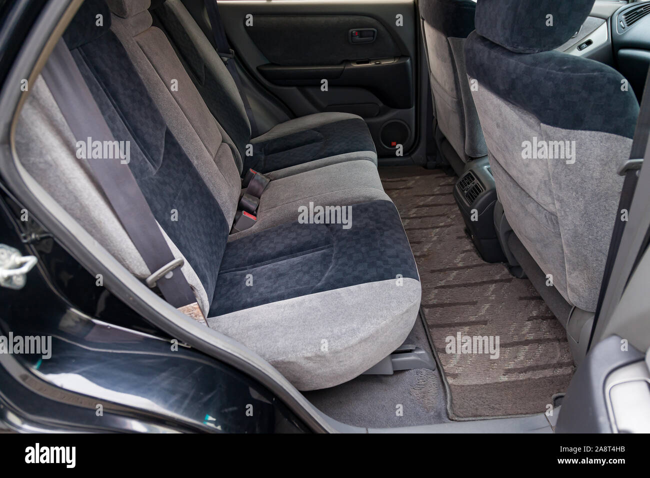 Novosibirsk, Russia - 11.05.2019: View to the gray interior of Toyota Harrier or Lexus RX300 with dashboard, clock, media system, rear seats and shift Stock Photo