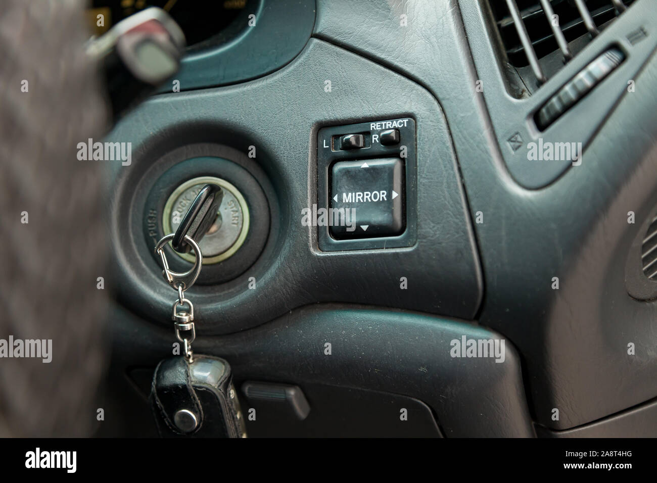 Novosibirsk, Russia - 11.05.2019: View to the gray interior of Toyota Harrier or Lexus RX300 with dashboard, key hole, mirror adjust buttons after cle Stock Photo