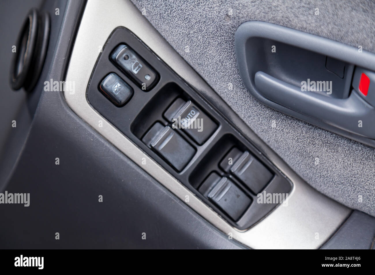 Novosibirsk, Russia - 11.05.2019: View to the gray interior of Toyota Harrier or Lexus RX300 with dashboard, door panel with window anв lock adjust bu Stock Photo