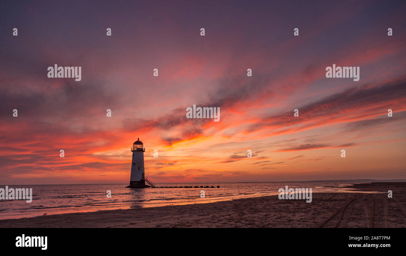 Point of ayr lighthouse at Talacre beach at sunrise on the North Wales coast Stock Photo