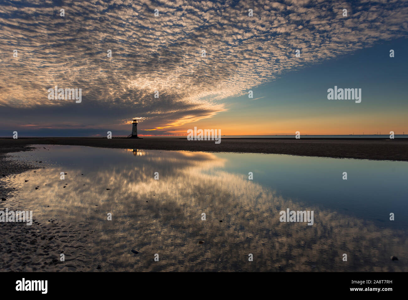 Point of Ayr lighthouse on Talacre beach at dusk, North Wales coast Stock Photo