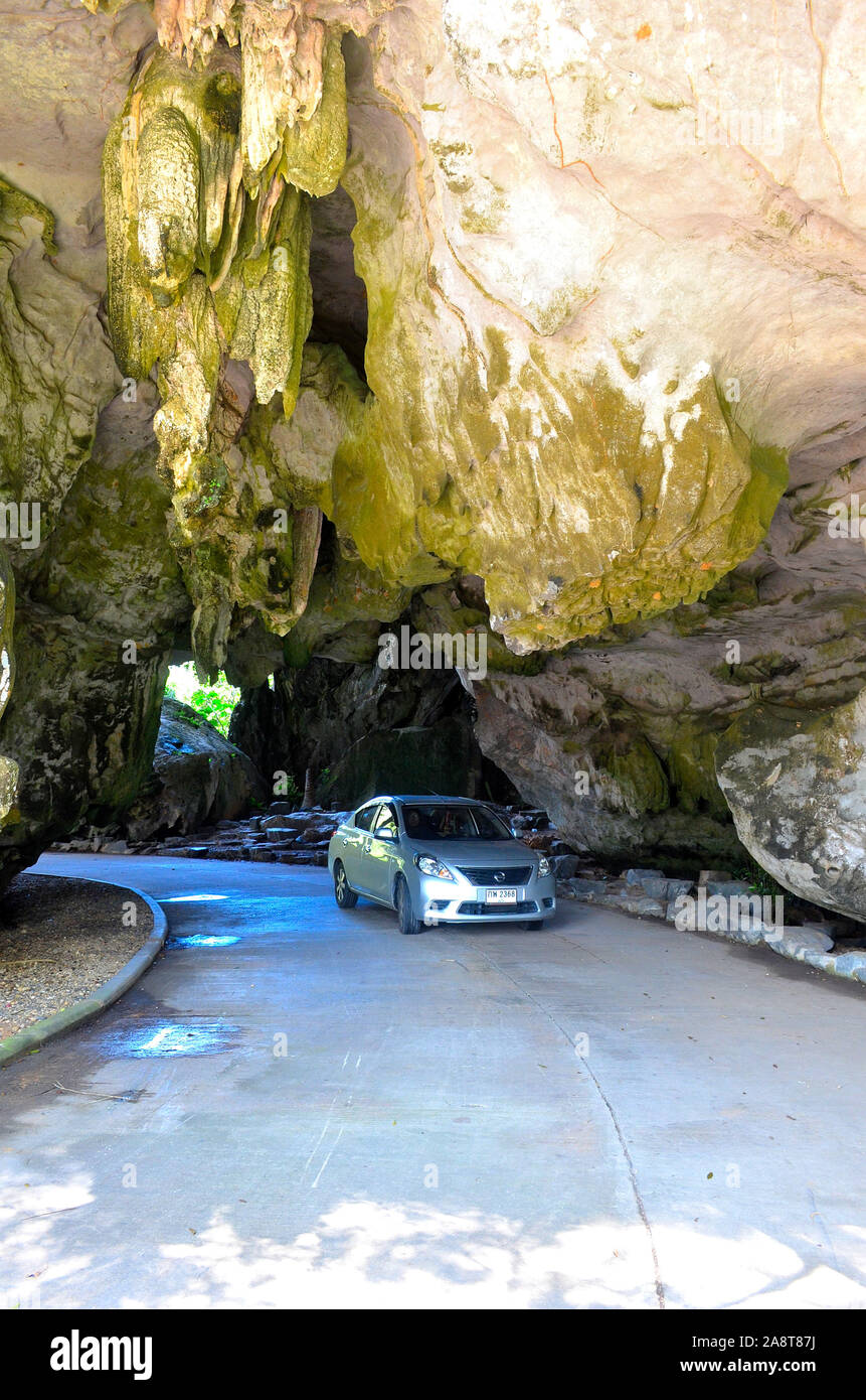 A car travelling through the entrance tunnel in the limestone karst at Somdet Phra Srinagarinda Park Phang Nga Town Thailand Asia Stock Photo