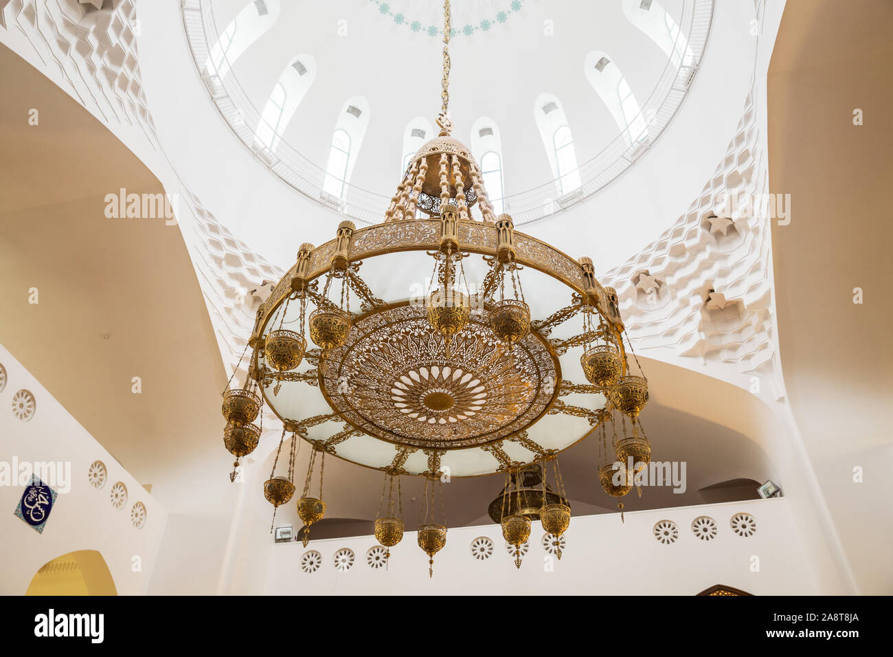 ST. PETERSBURG, RUSSIA - OCTOBER 26, 2019: beautiful chandelier made of glass and metal in interior of the cathedral mosque in Saint Petersburg Stock Photo