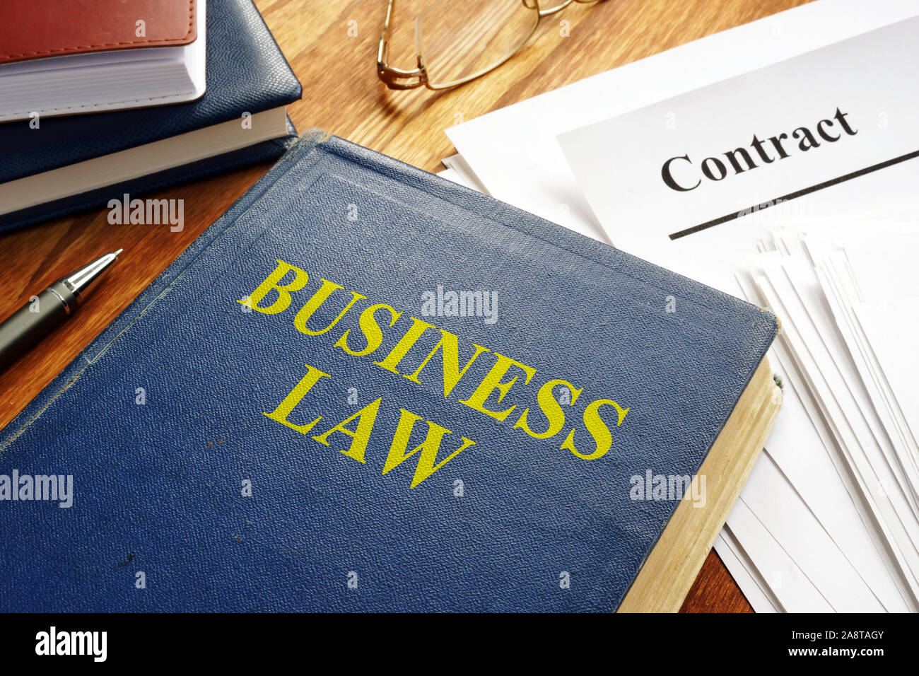 Business law book and corporate contract. Stock Photo