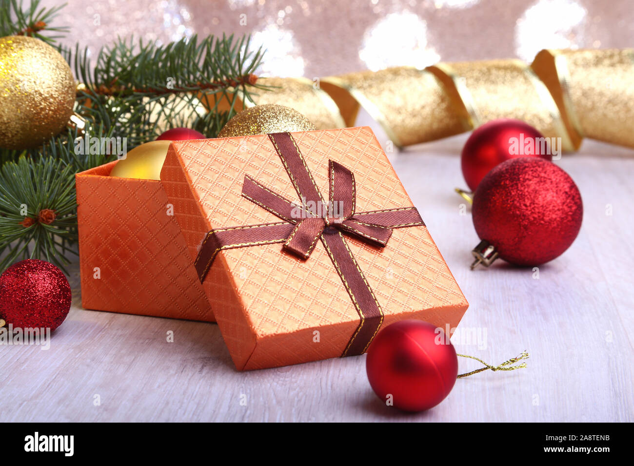 Christmas decoration with gift boxes, colorful christmas balls and christmas tree on a blurry, sparkling and fabulous background.. Stock Photo