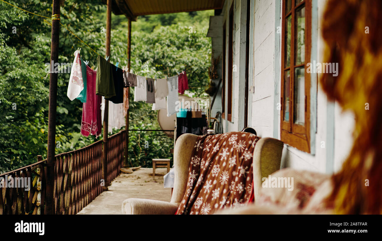 Clothes drying on rope line on a balcony - rural life. The interior of the  old terrace Stock Photo - Alamy