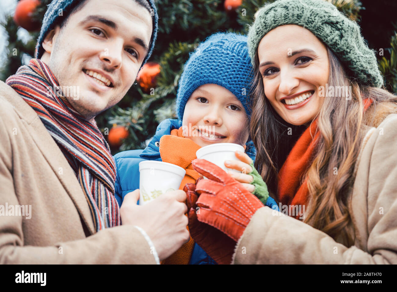 Family visiting Christmas Market Stock Photo Alamy