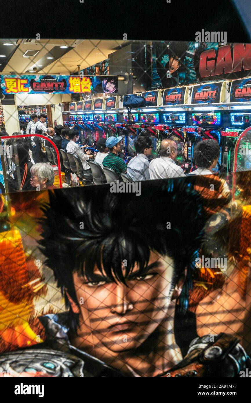 Players at a 'pachinko' parlor in Shibuya district, Tokyo, Japan Stock Photo
