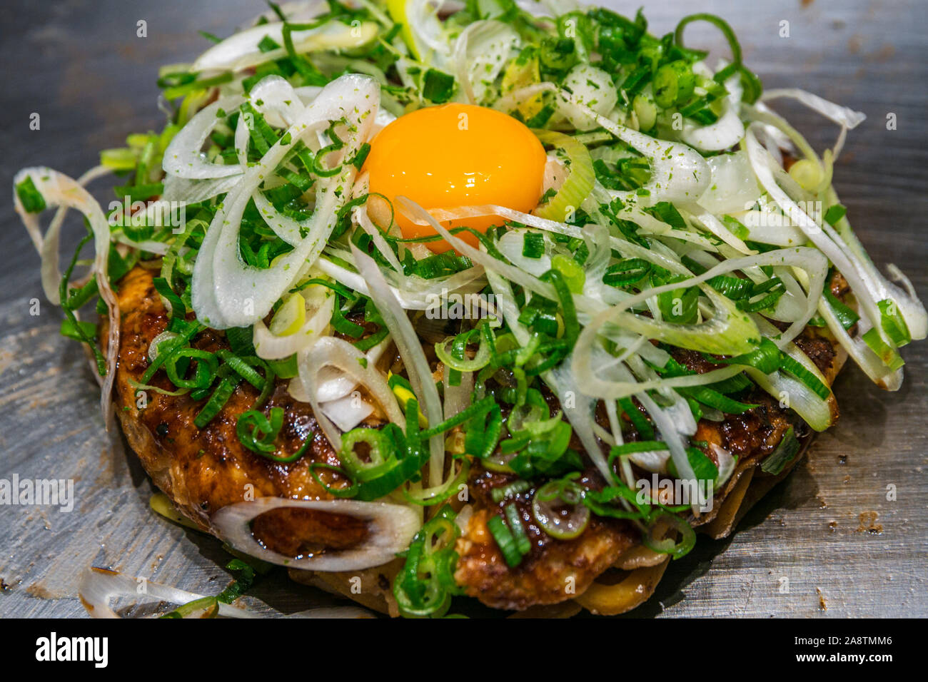 Minced chicken vegetable pankake with Green Onion. Kashiwa Restaurant. Shibuya Hikarie Shopping Centre. Shibuya Neighborhood. Tokyo. Japan Stock Photo