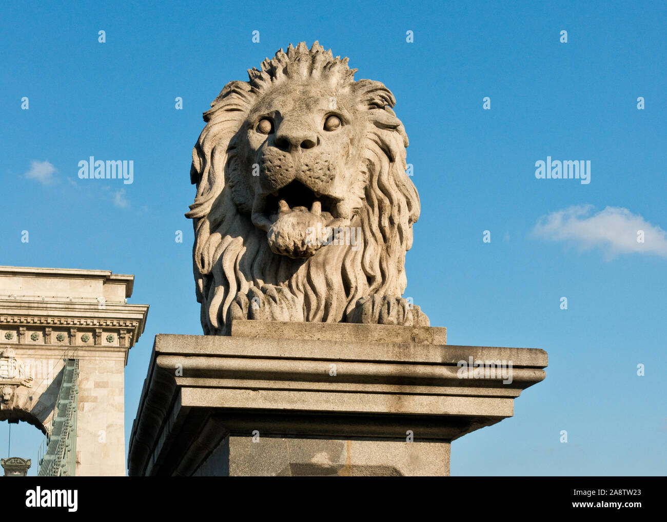 Lion statue on plinth of Budapest Szechenyi Chain Bridge Stock Photo