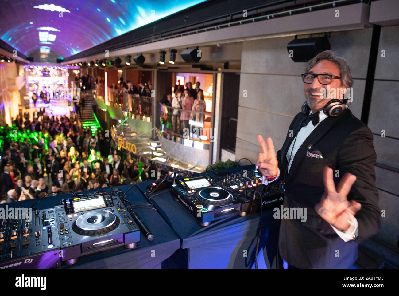 Hamburg, Germany. 09th Nov, 2019. Mousse T., music producer and DJ, stands on the decks at a party in the plaza on board the cruise ship MSC Grandiosa after the christening ceremony. Credit: Christian Charisius/dpa/Alamy Live News Stock Photo
