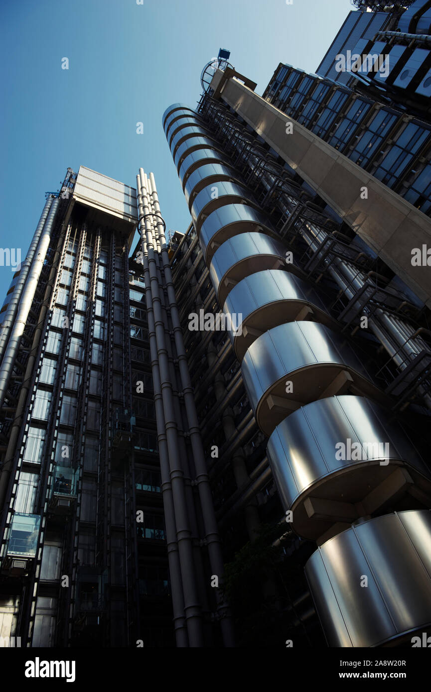 LONDON - MAY 3, 2012: The exterior of the Lloyd's building, finished in 1986, shines under bright blue sky. Stock Photo