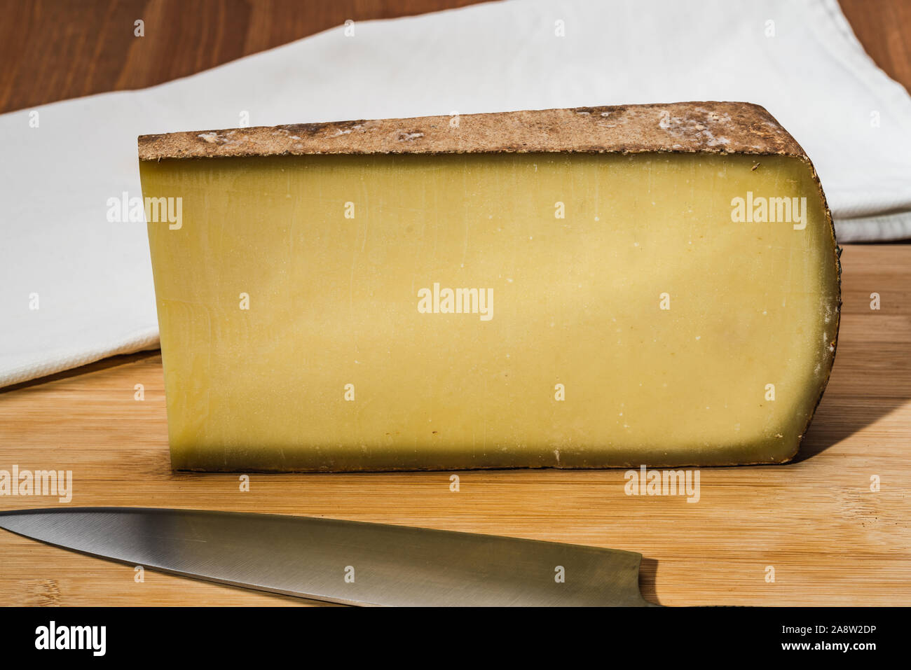 Comte an aged French cheese made from unpasteurized cow's milk Stock Photo