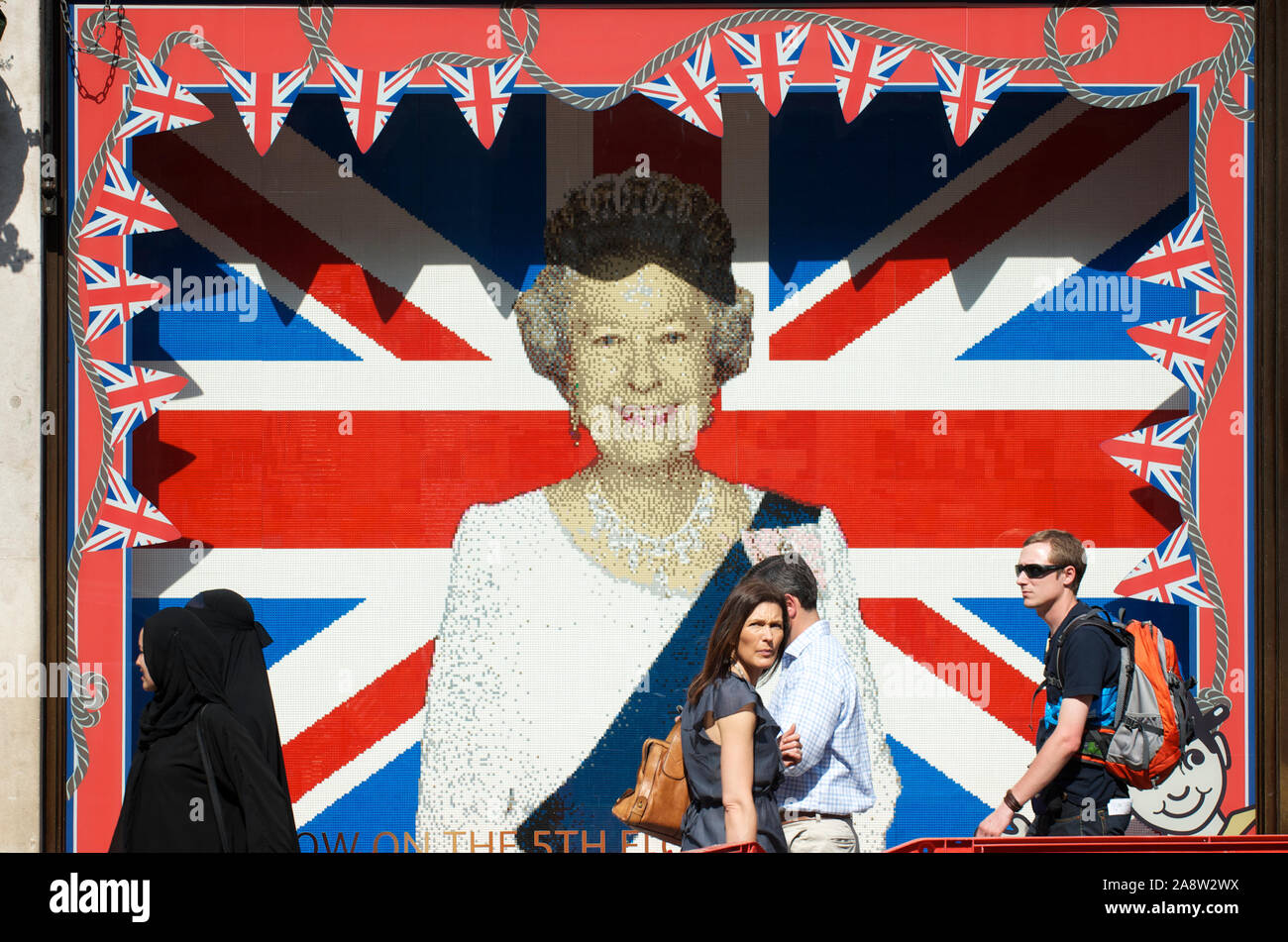 LONDON - MAY 24, 2012: Pedestrians pass a Union Jack portrait of the Queen  made of Lego blocks outside Hamley's Toy Shop on Regent Street Stock Photo  - Alamy