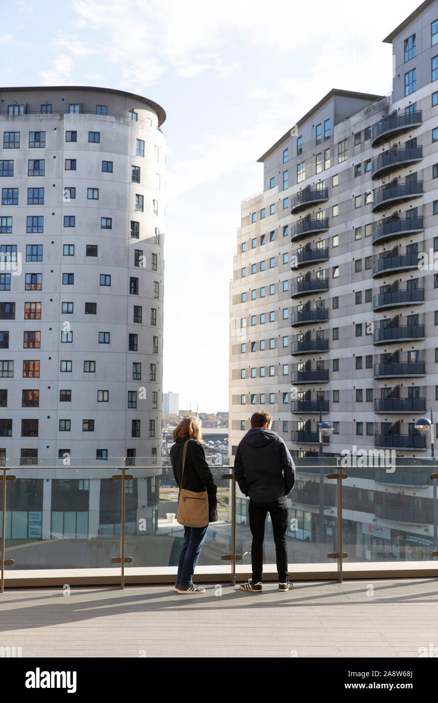 Mother and son looking at new build apartments in central Birmingham Stock Photo