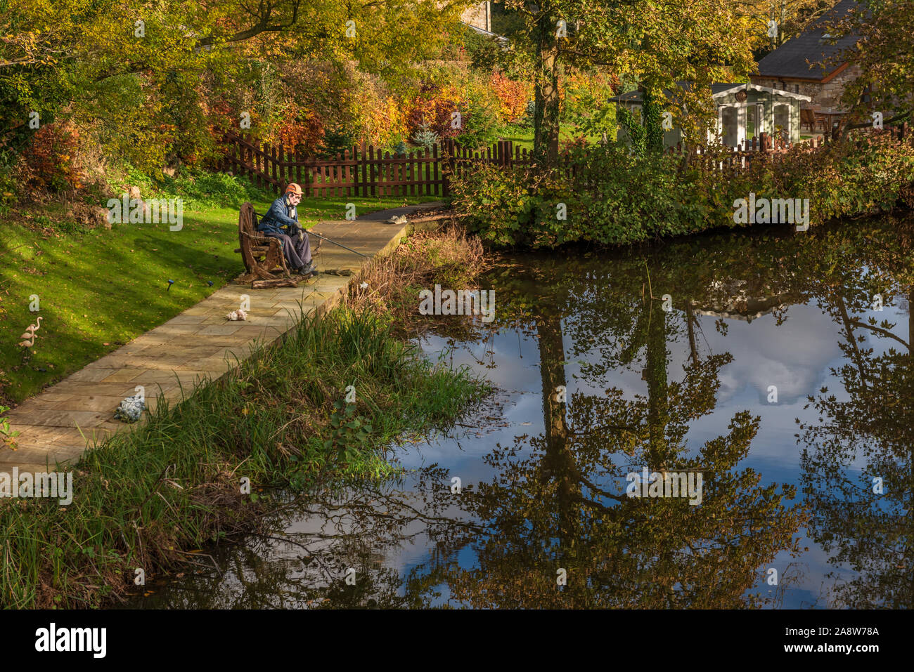 Scarecrow Fishing on The Lancaster Canal Forton in Lancashire Stock Photo