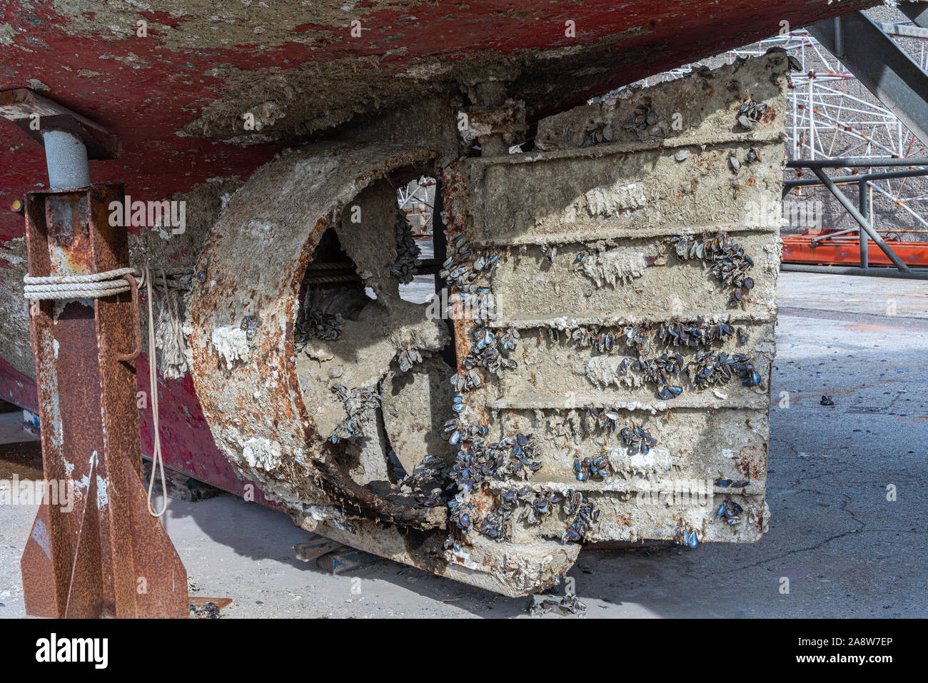 stern of a fishing boat with incrustations of mussels, mud Stock Photo