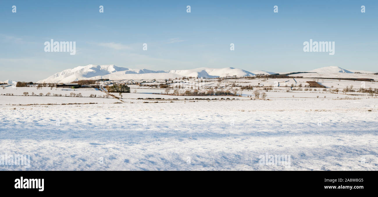 Snow covered Lake District panorama of the North Eastern Fells including Blencathra and Souther Fell  in Winter Stock Photo