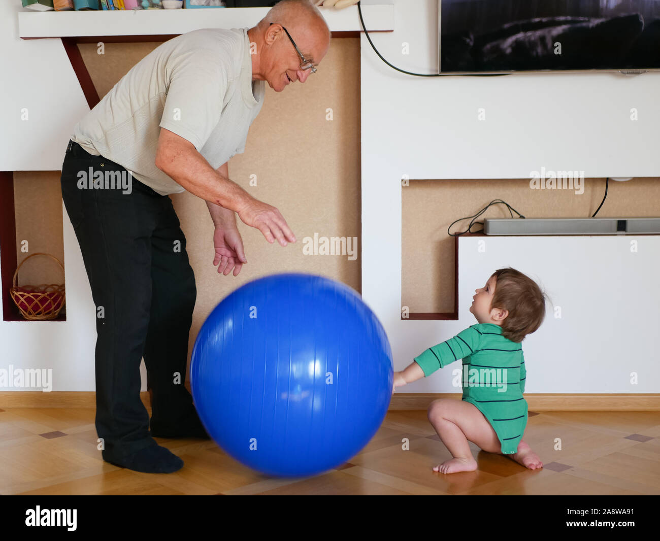 Grandfather Plays Ball With His Grandson The Relationship Between grandfather-plays-ball-with-his-grandson-the-relationship-between