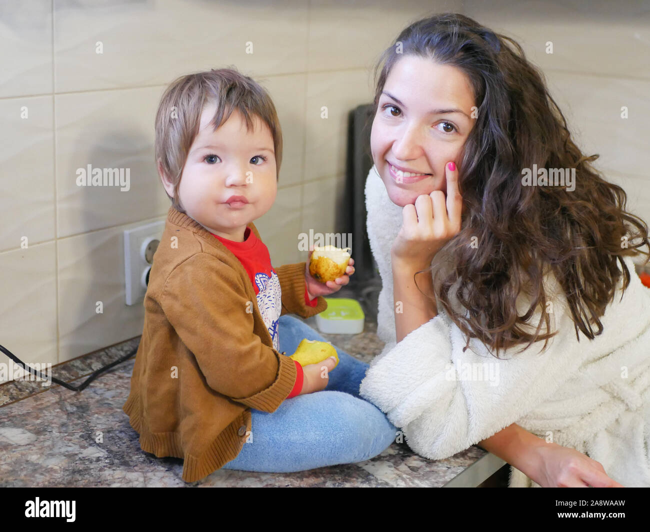 he child eats a pear. Baby and motherhood. Healthy eating Vitamins and