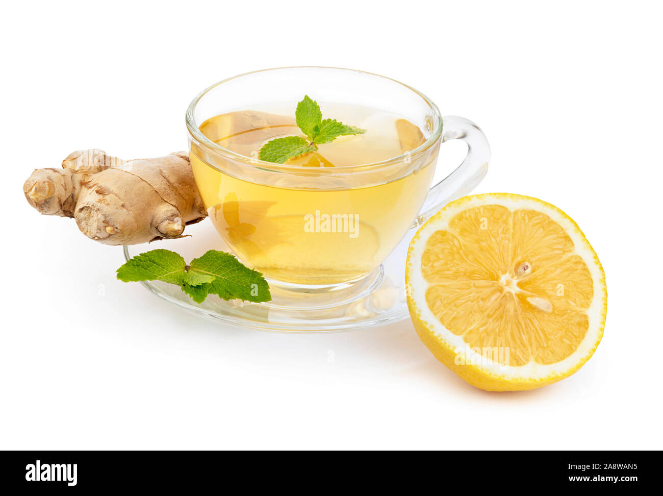Hot herbal tea with mint leaves, ginger and lemon isolated on white ...