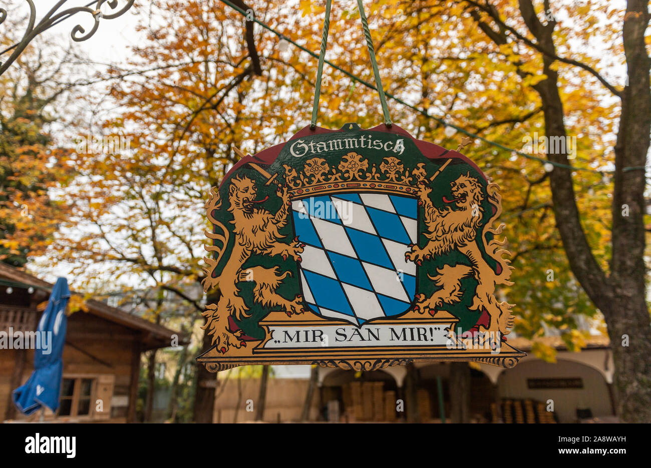 Munich, Germany. 11th Nov, 2019. A Stammtisch sign with the inscription 'Mir san Mir' hangs in the autumnally empty beer garden at Wienerplatz in the district of Haidhausen. Credit: Peter Kneffel/dpa/Alamy Live News Stock Photo
