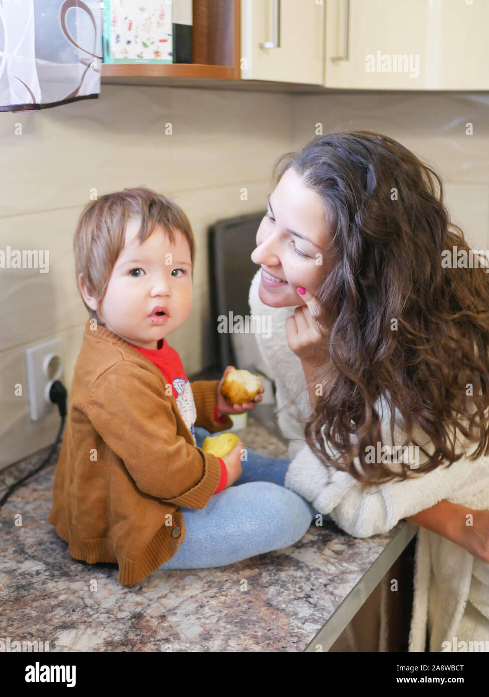 he child eats a pear. Baby and motherhood. Healthy eating Vitamins and