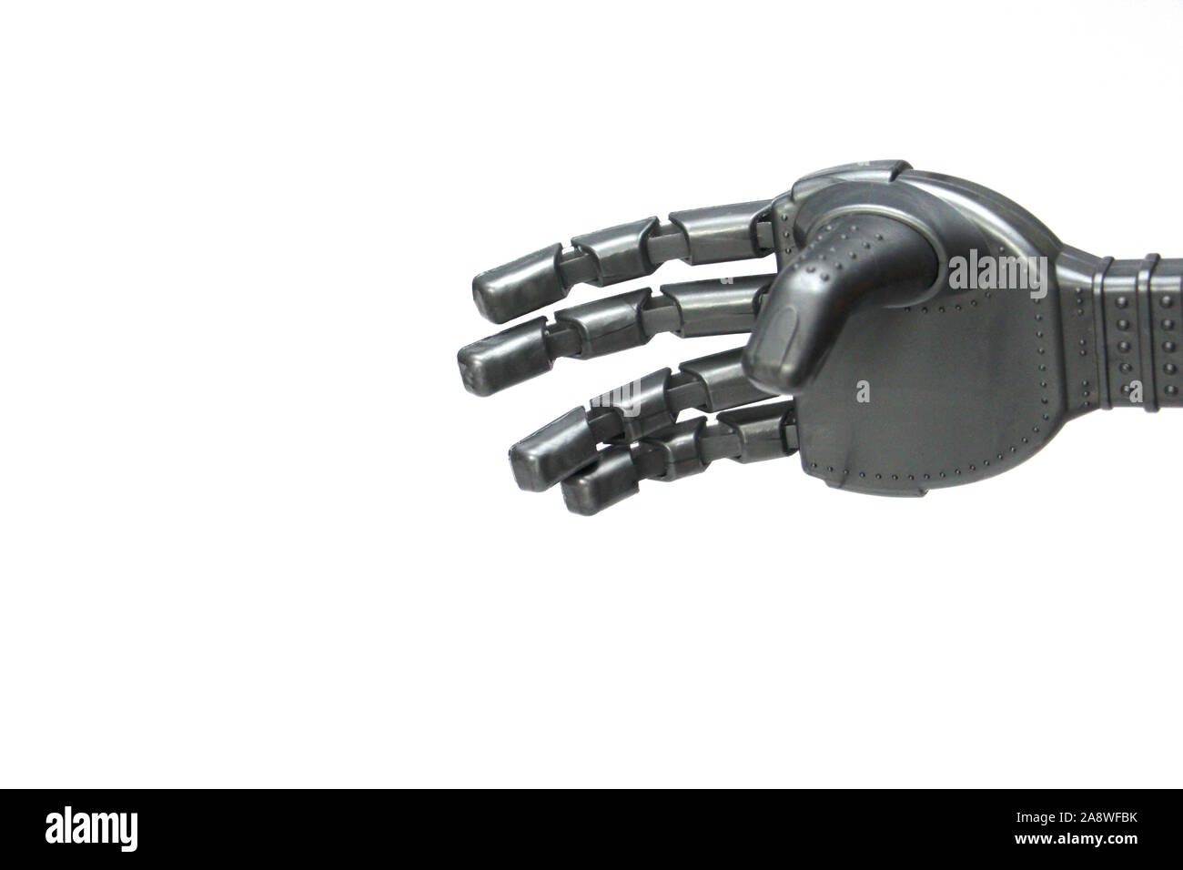 Robot hand on a white background. Modern cybernetics. The concept of robotics in the modern world. Stock Photo