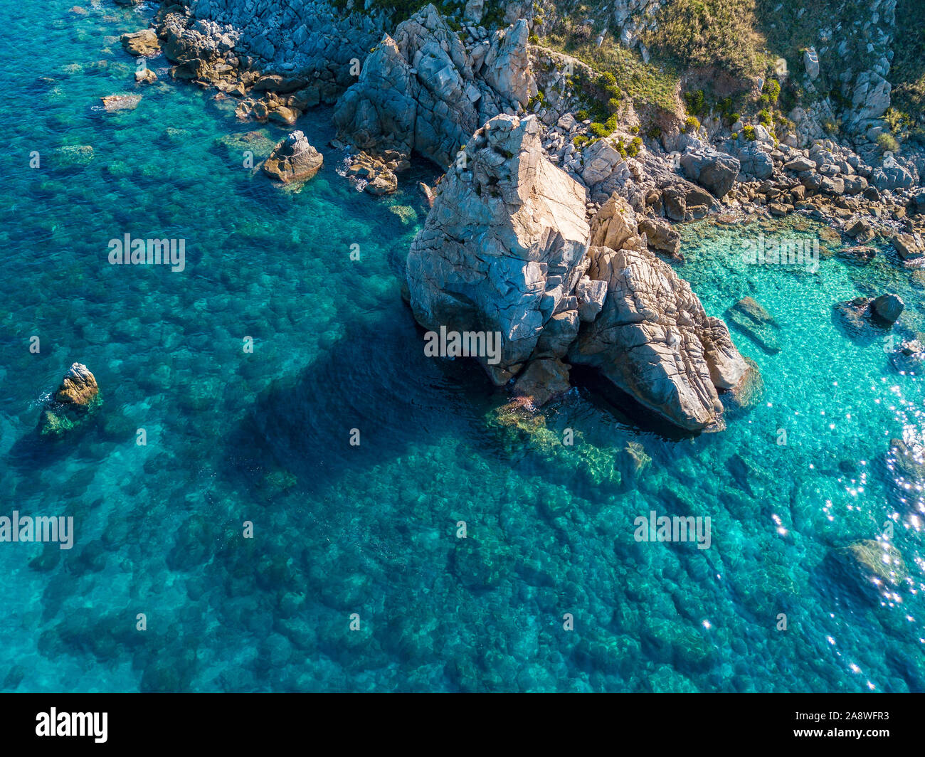 Aerial view of Tropea beach, crystal clear water and rocks that appear ...