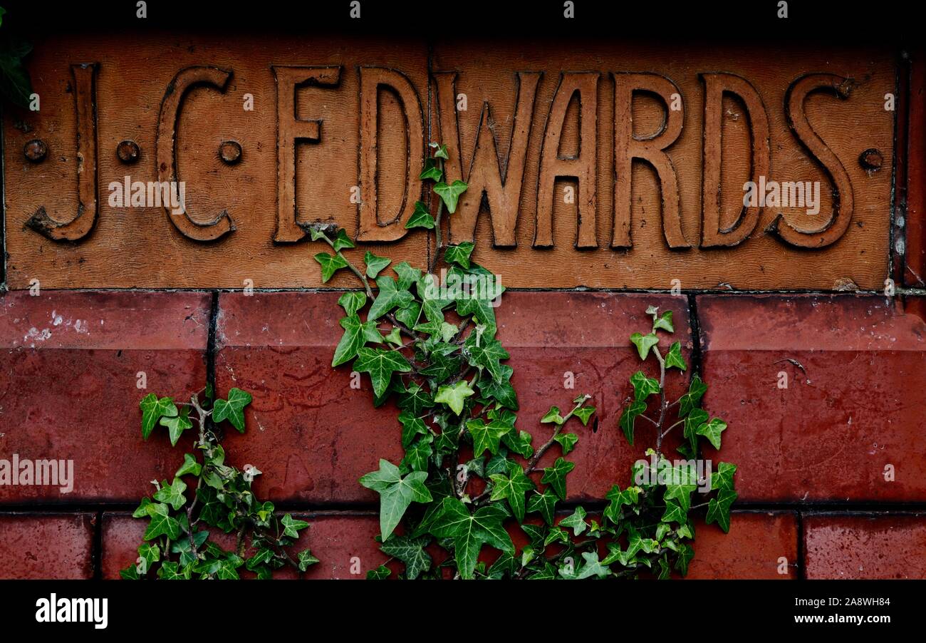 Terracotta name plate from abandoned factory Stock Photo