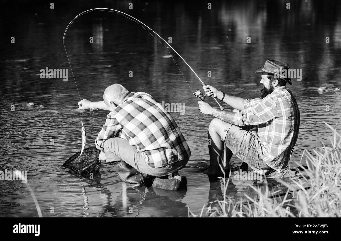 Father son ready fishing Black and White Stock Photos & Images - Alamy