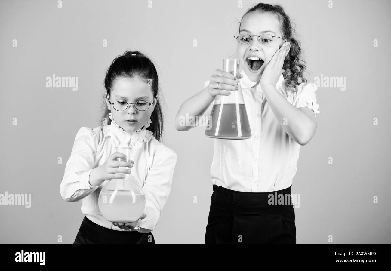 Basic knowledge. Knowledge day. Schoolgirls friends with chemical