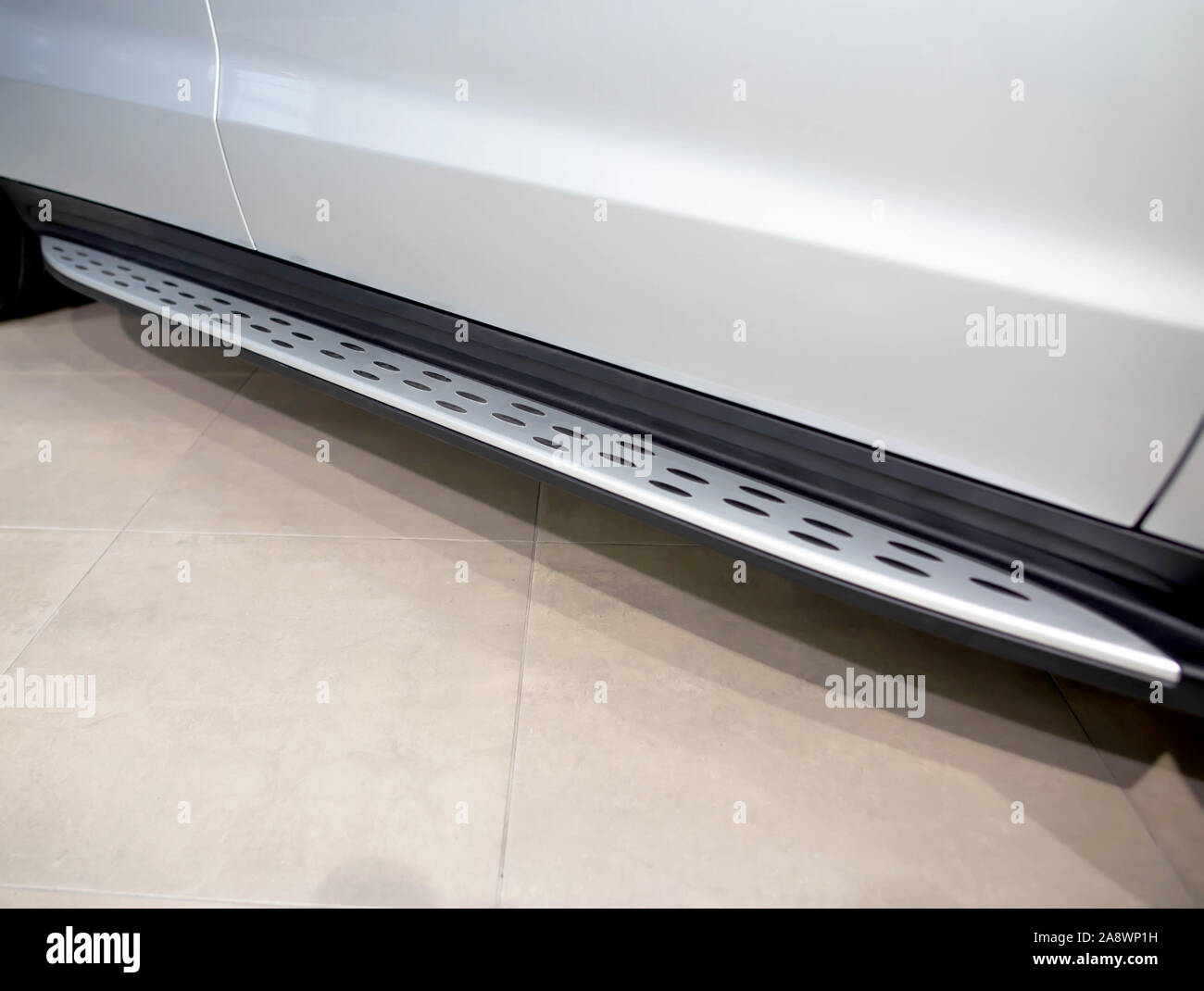 Modern footboard on an SUV car for the convenience of passengers and