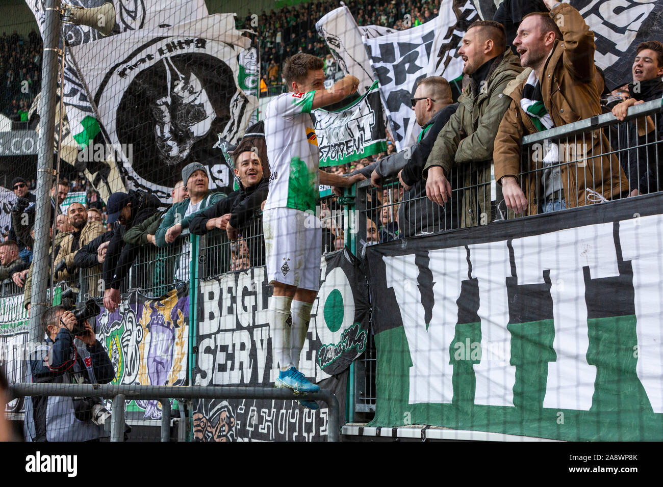 sports, football, Bundesliga, 2019/2020, Borussia Moenchengladbach vs. SV Werder Bremen 3-1, Stadium Borussia Park, Gladbach team celebrates the victory, fans give thanks to the double goal scorer Patrick Herrmann (MG), DFL REGULATIONS PROHIBIT ANY USE OF PHOTOGRAPHS AS IMAGE SEQUENCES AND/OR QUASI-VIDEO Stock Photo