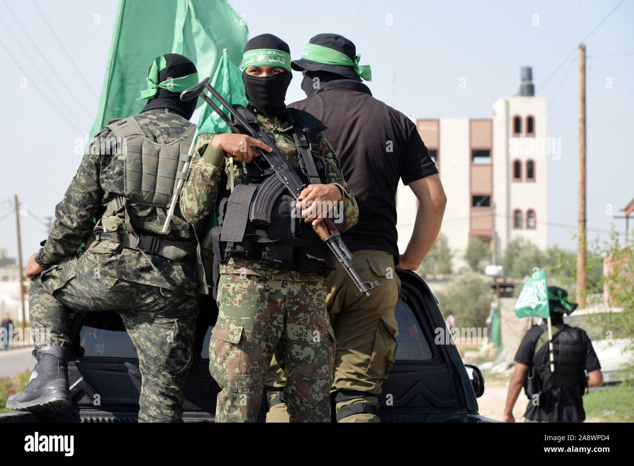 Khan Younis, Gaza, Palestinian  members of al-Qassam  Brigades, the armed wing of the Hamas movement, hold their weapons during  an anti-Israel military parade in the southern Gaza Strip city of Khan