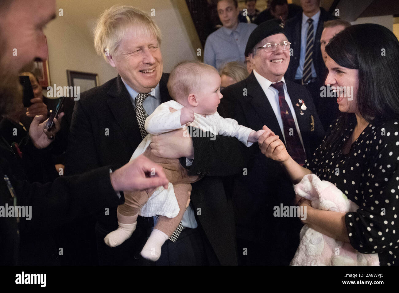 Prime Minister Boris Johnson meets six month old Willow Rose Anderson, at the Lych Gate Tavern in Wolverhampton. Stock Photo