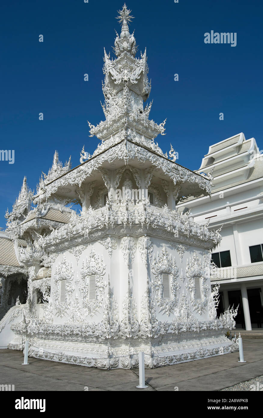section of wat rong khun, or the white temple, chiang rai, thailand, an artwork in the style of a thai temple by artist chalermchai kositpipat Stock Photo